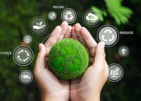 Hands holding a green globe surrounded by sustainability icons